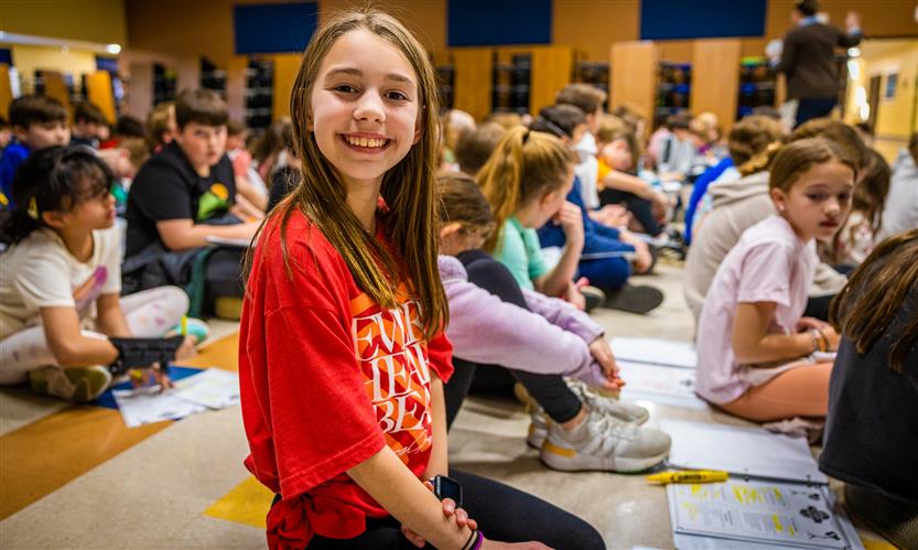 Teachers and students participate in a '20s catwalk presentation